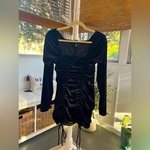 Synched, black, long sleeve dress.